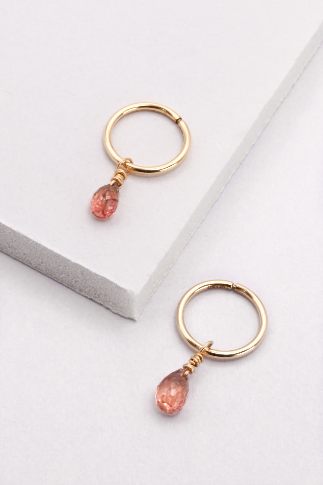 Gold Seamless Huggie Hoops with Red Sapphire Drops