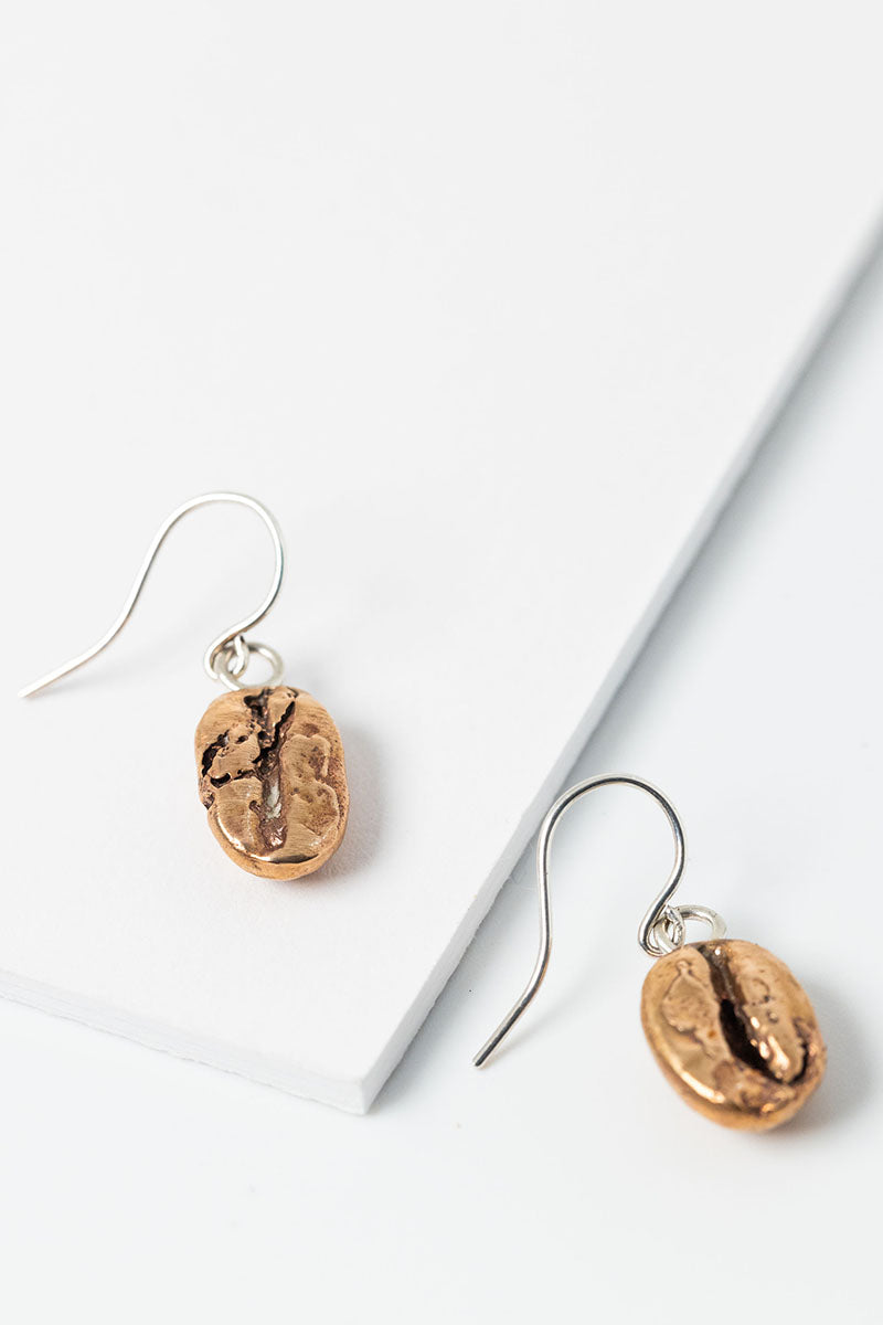 Bronze coffee bean drop earring pair with sterling silver earrings; handcrafted unisex earrings by Alison Jefferies for J'Adorn Designs artisan jewelry, made in Baltimore.