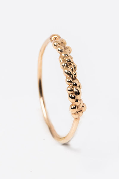 Top view of 14k yellow gold stacking ring with organic textured top by Alison Jefferies for J'Adorn Designs jewelry