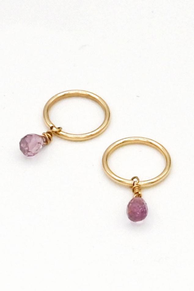 Gold seamless huggie hoop earrings with purple sapphire teardrop charms