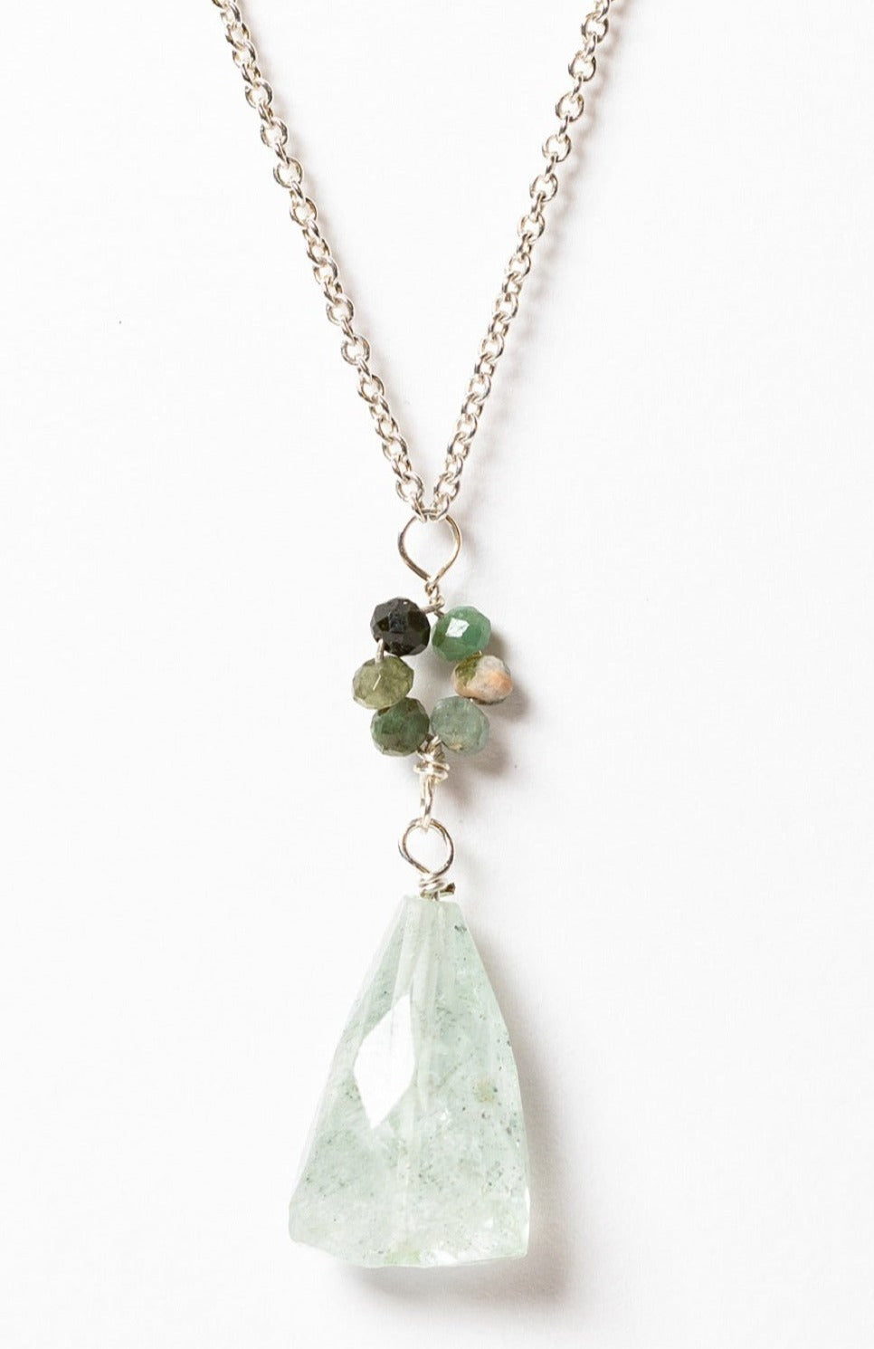 Oceanic pendant necklace in silver with a blue and green "flower" pendant and long light blue faceted drop pendant. Sterling silver necklace in cool ocean colors, handcrafted by J'Adorn Designs artisan Alison Jefferies