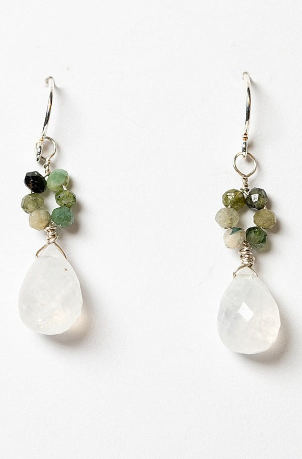 Small silver drop earrings with moonstone teardrops and green tourmaline flowers. Handcrafted earrings and custom jewelry by J'Adorn Designs artisan Alison Jefferies