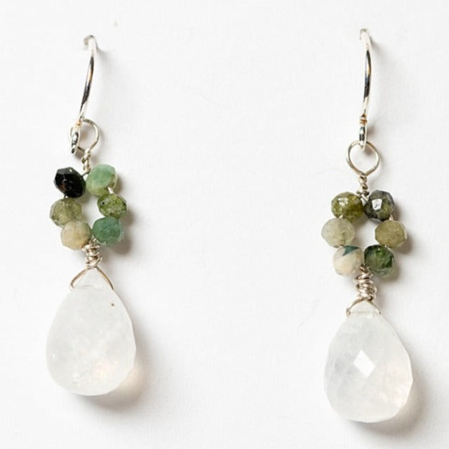 Small silver drop earrings with moonstone teardrops and green tourmaline flowers. Handcrafted earrings and custom jewelry by J'Adorn Designs artisan Alison Jefferies