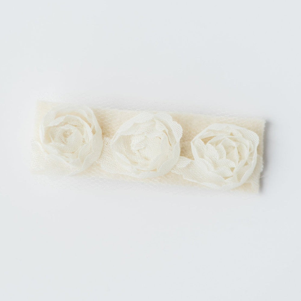 Couture flower girl hair clip appropriate for young girls toddler to tween. Ivory fabric rosettes over felt attached to silver plated clip. Made by hand by J'Adorn Designs, Baltimore Maryland couture and custom jewelry studio, photography by Nichole Rosado Meredith