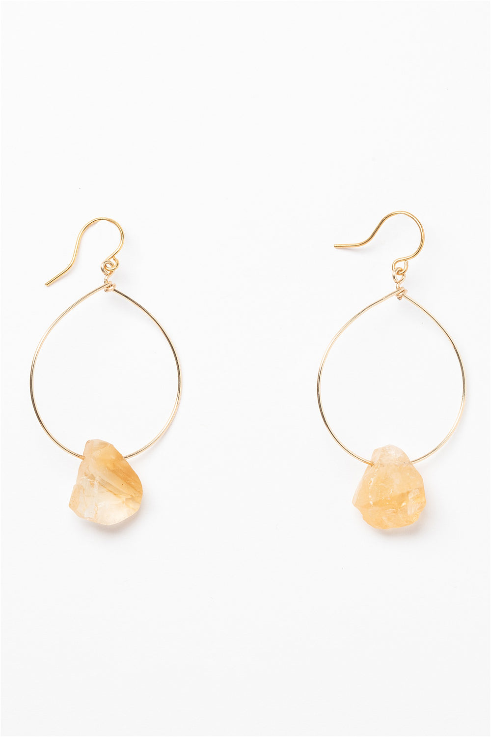 One pair of gold hoop earrings for sale with rough citrine teardrops. 14k gold filled modern hoop earrings for fashion or a jewelry gift idea. Artisan jewelry and luxury bridal accessories handmade in Maryland by Alison Jefferies of J'Adorn Designs.