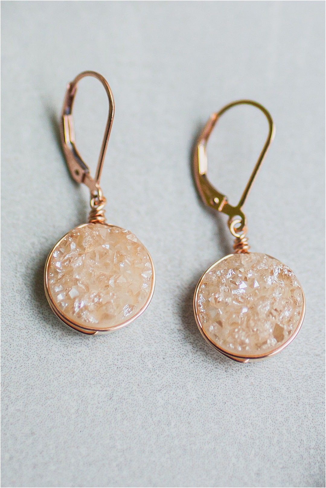 Delicate rose gold druzy earrings with lightweight wire wrap. Sparkly gemstone earrings by J'Adorn Designs artisan jewelry and luxury bridal accessories.