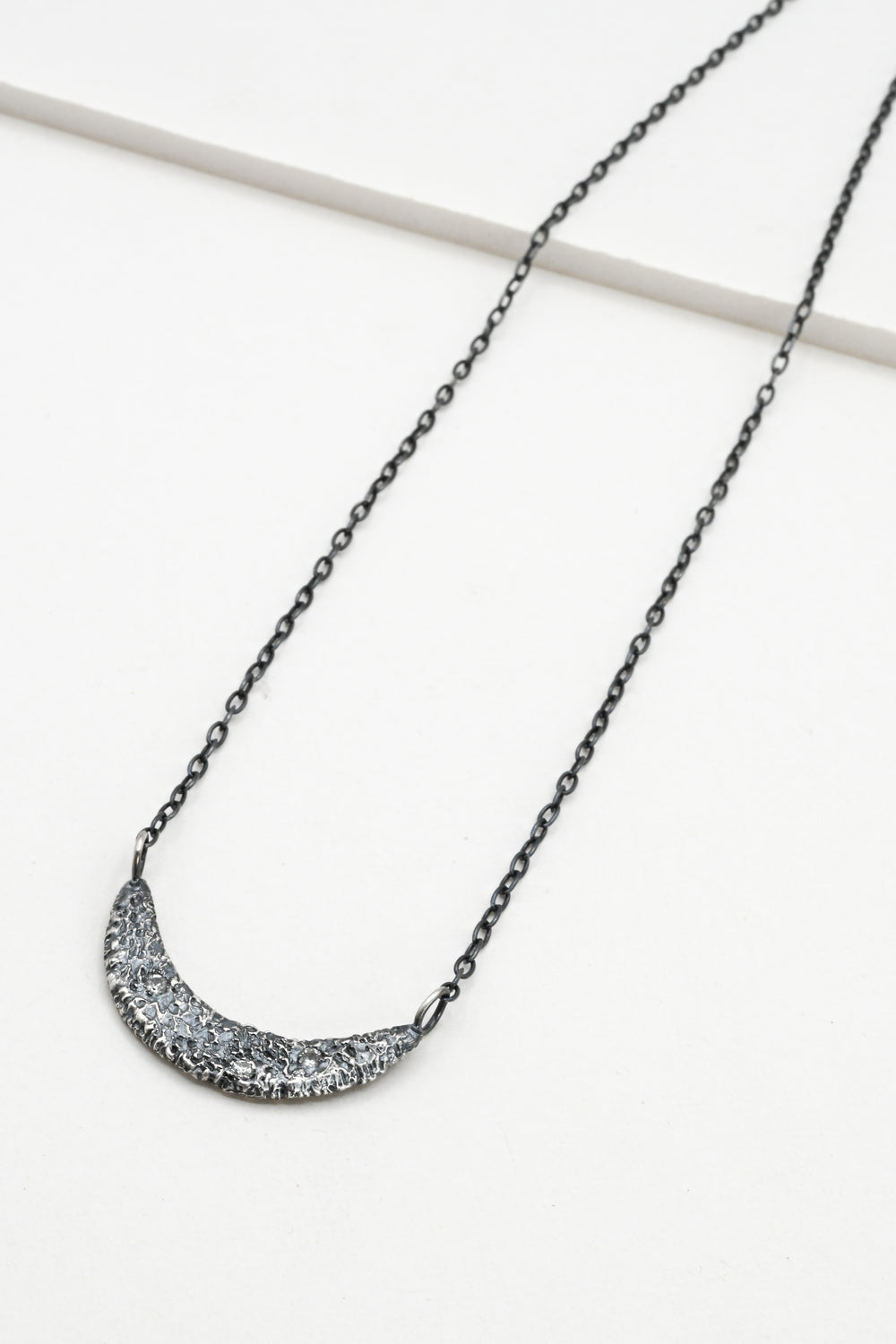 Textured oxidized silver collar necklace with three white sapphires 