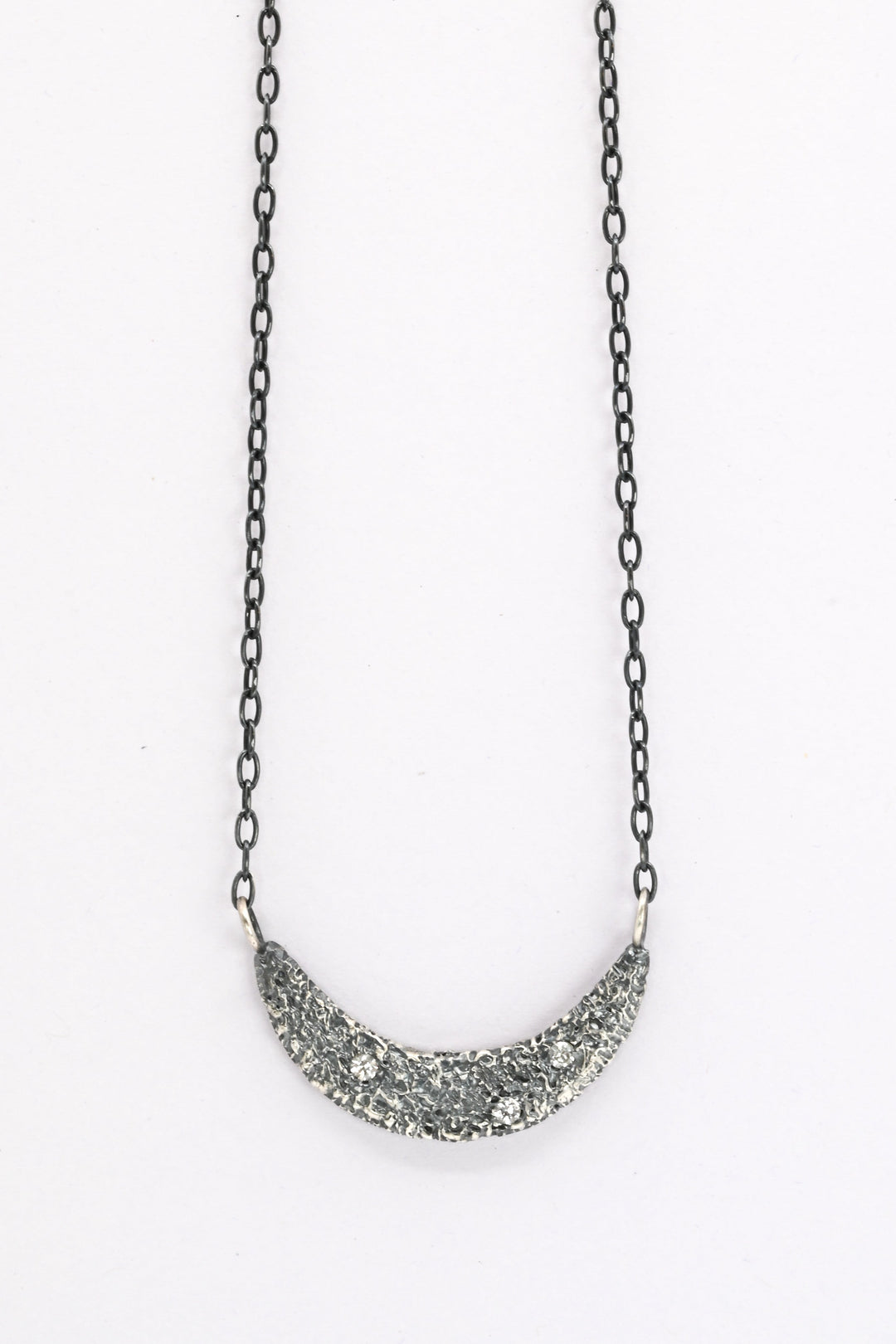 Textured oxidized silver collar necklace with three white sapphires 