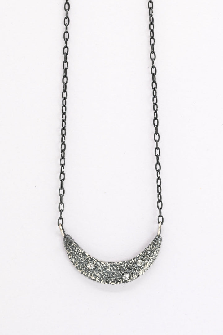 Textured oxidized silver collar necklace with three white sapphires 