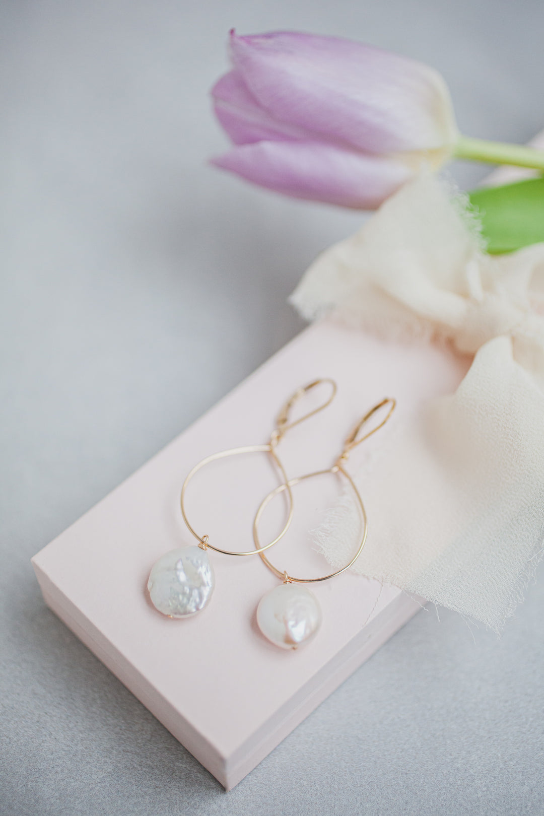 Delicate gold hoop earrings with white freshwater coin pearl drops, hand crafted jewelry by Alison Jefferies of J'Adorn Designs