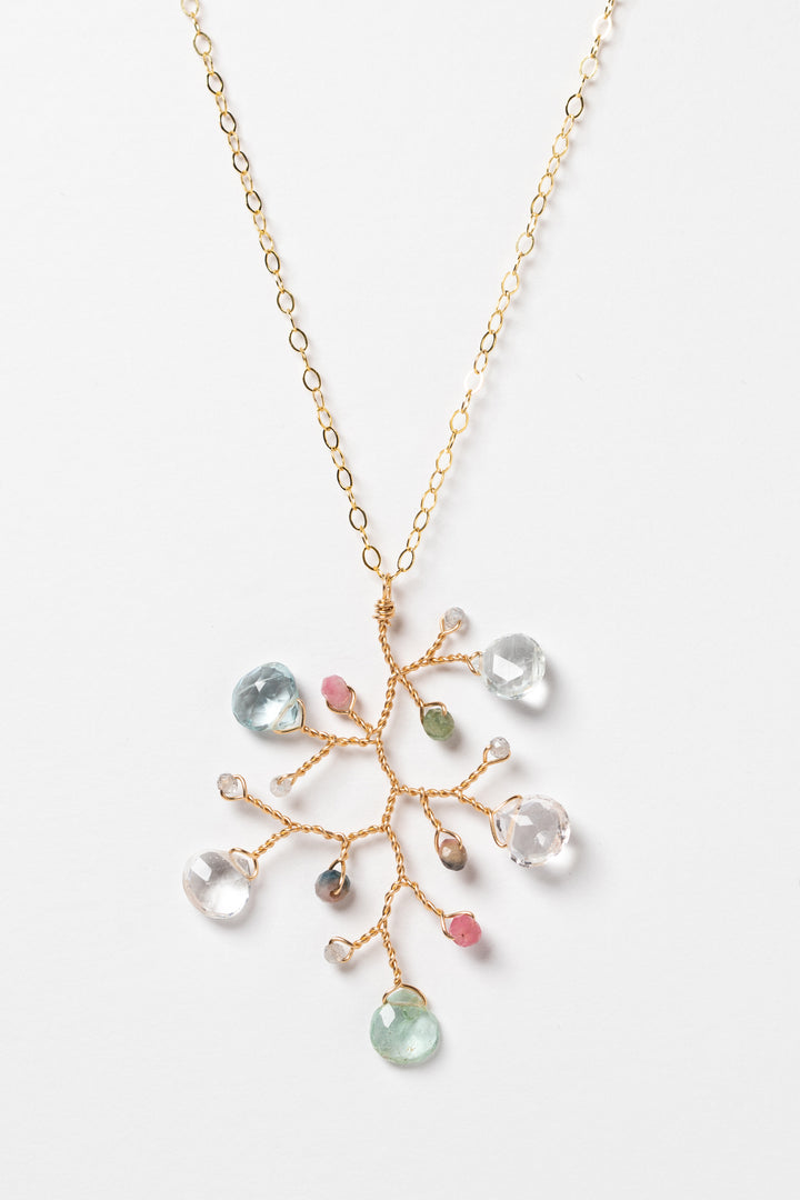 One handcrafted gold pendant featuring a wire-wrapped branch with aquamarine teardrops and tourmaline beads in a rainbow of colors. A lightweight, hypoallergenic gemstone necklace on a fine 14k gold filled chain. Artisan jewelry made by Alison Jefferies for J'Adorn Designs.