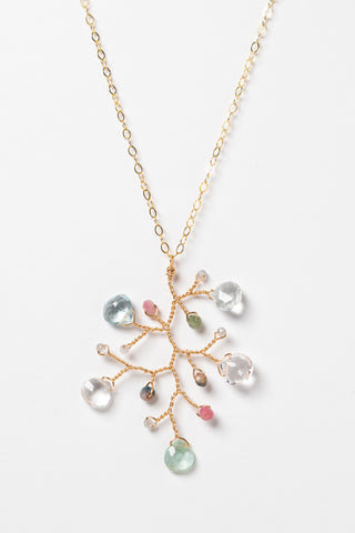 One handcrafted gold pendant featuring a wire-wrapped branch with aquamarine teardrops and tourmaline beads in a rainbow of colors. A lightweight, hypoallergenic gemstone necklace on a fine 14k gold filled chain. Artisan jewelry made by Alison Jefferies for J'Adorn Designs.