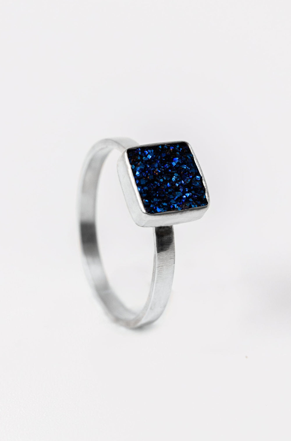 Sterling silver bezel ring with dark blue square druzy solitaire. Handcrafted silver and druzy ring by Alison Jefferies for J'Adorn Designs jewelry.