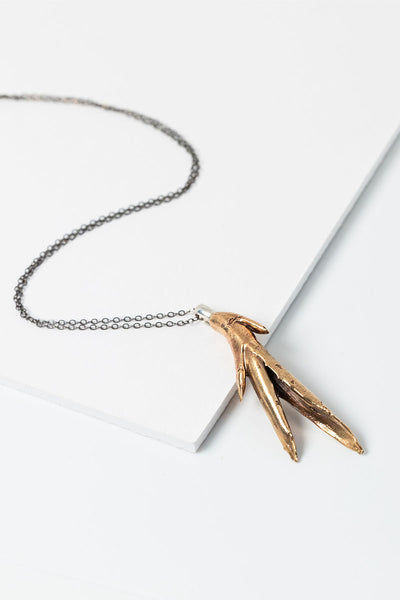 Bronze aloe plant pendant necklace with oxidized silver chain by jewelry artist Alison Jefferies for J'Adorn Designs