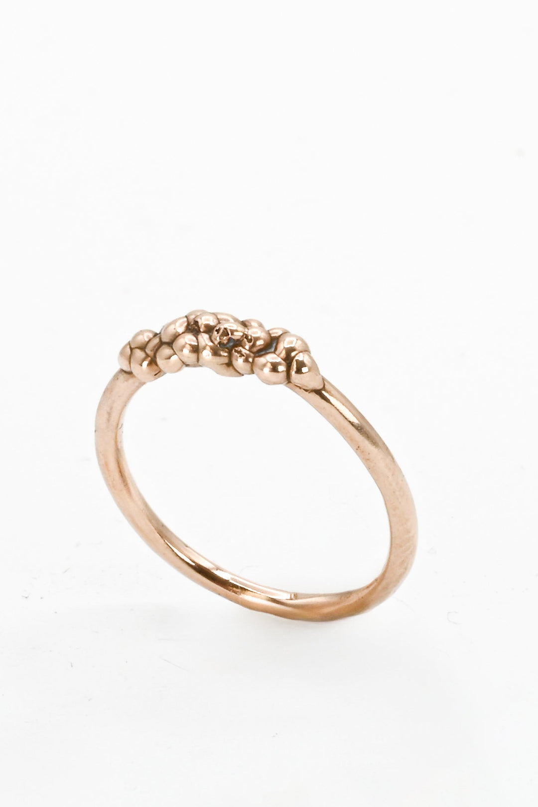 Angled view of bronze cast "bubble band" stacking ring by J'Adorn Designs
