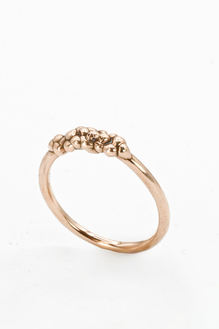 Angled view of bronze cast "bubble band" stacking ring by J'Adorn Designs