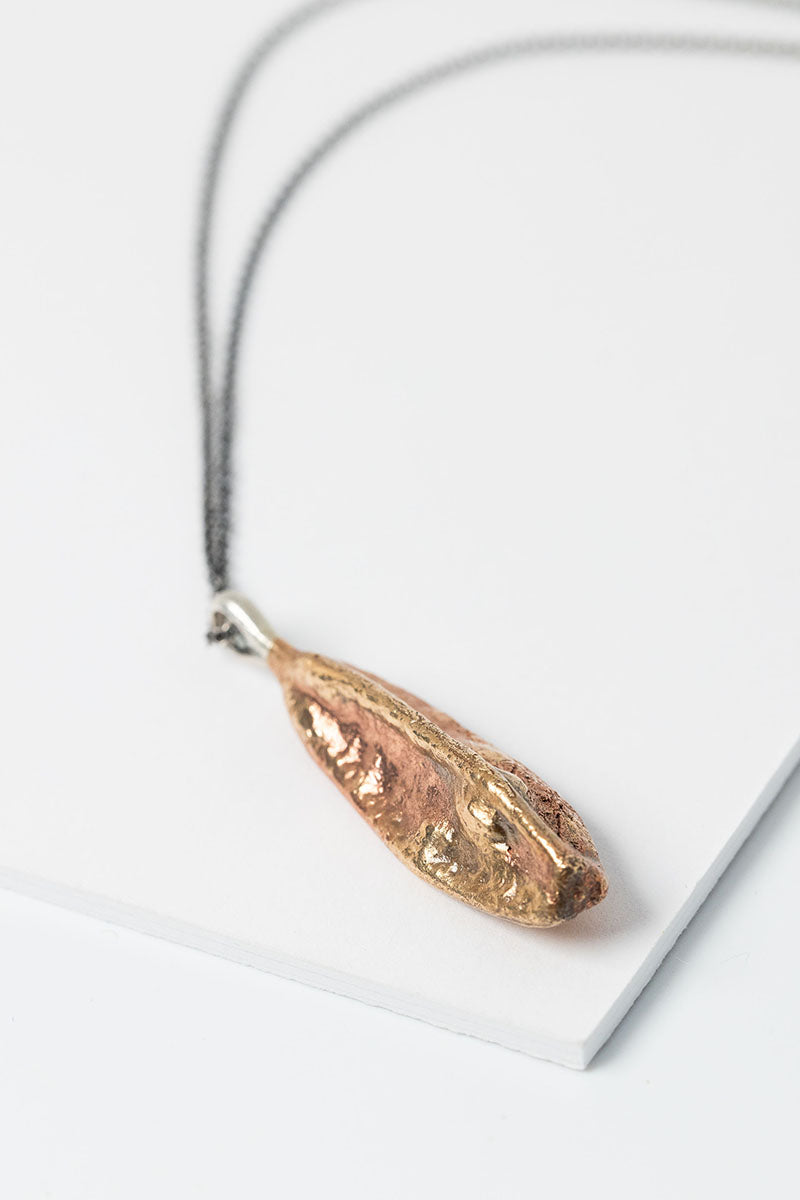 Cast Bronze Iris Flower Seed Pod Necklace with long oxidized sterling silver cable chain