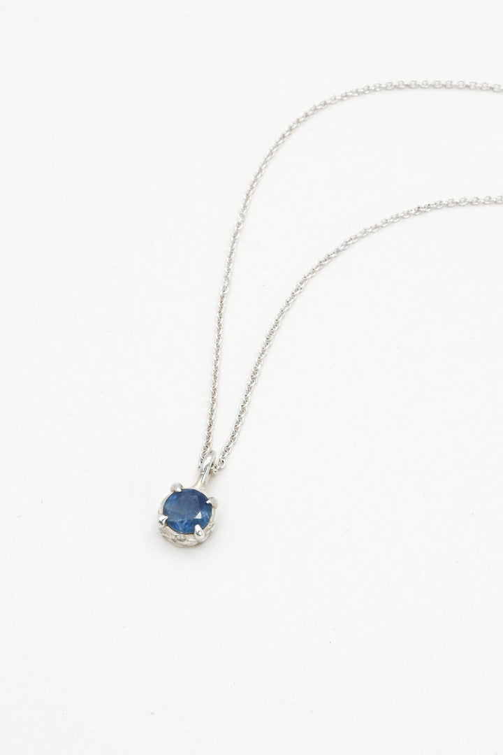 Round blue sapphire in a pronged sterling silver cast setting on a delicate silver chain by J'Adorn Designs