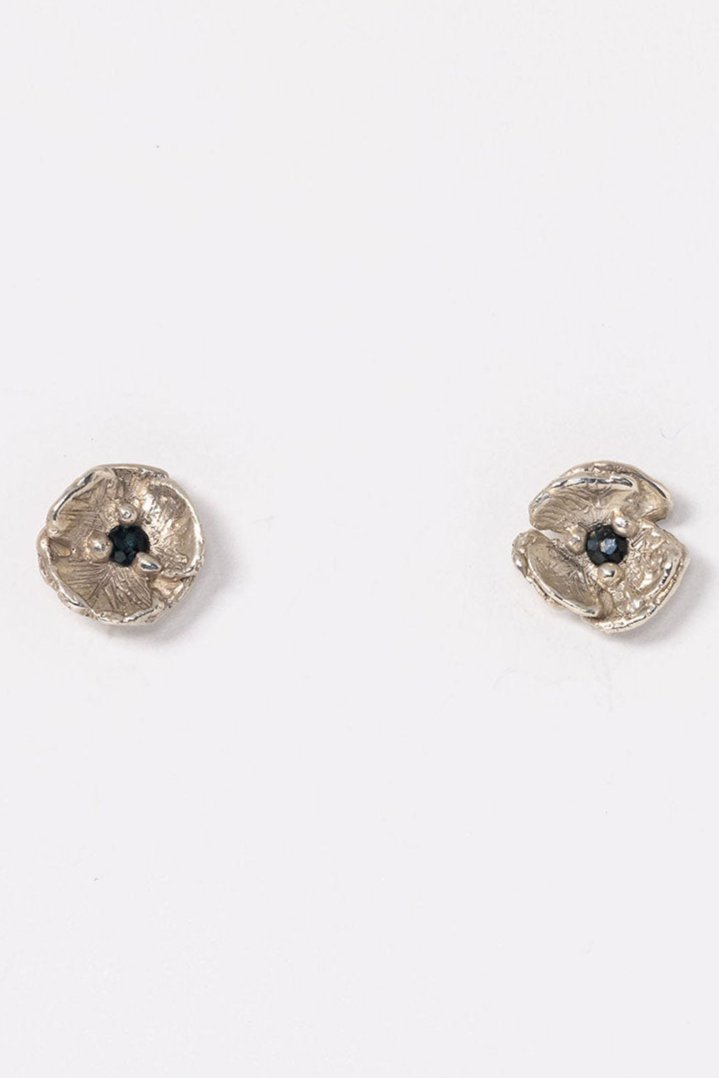 Small dainty flower stud earrings in sterling silver with Montana sapphire centers and layered realistic petals. 