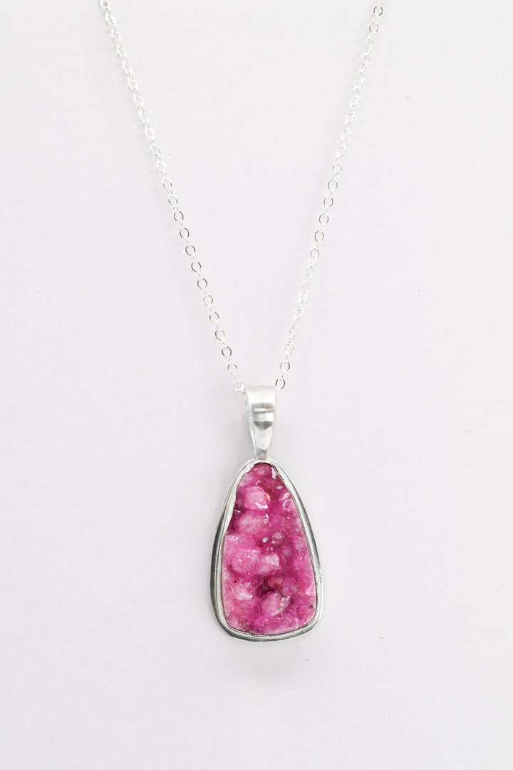 Hot pink triangle cobaltocalcite pendant on a delicate sterling silver chain