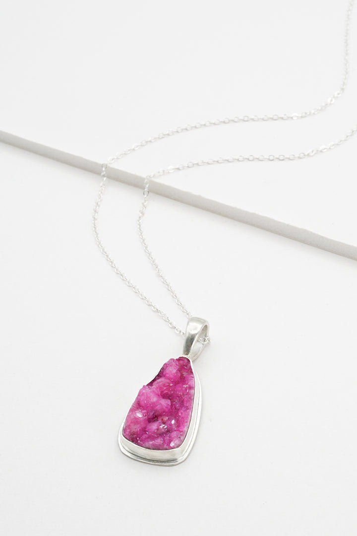 Hot pink triangle cobaltocalcite pendant on a delicate sterling silver chain