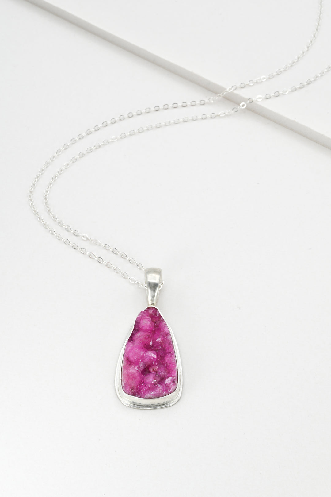 Hot pink triangle cobaltocalcite pendant on a delicate sterling silver chain