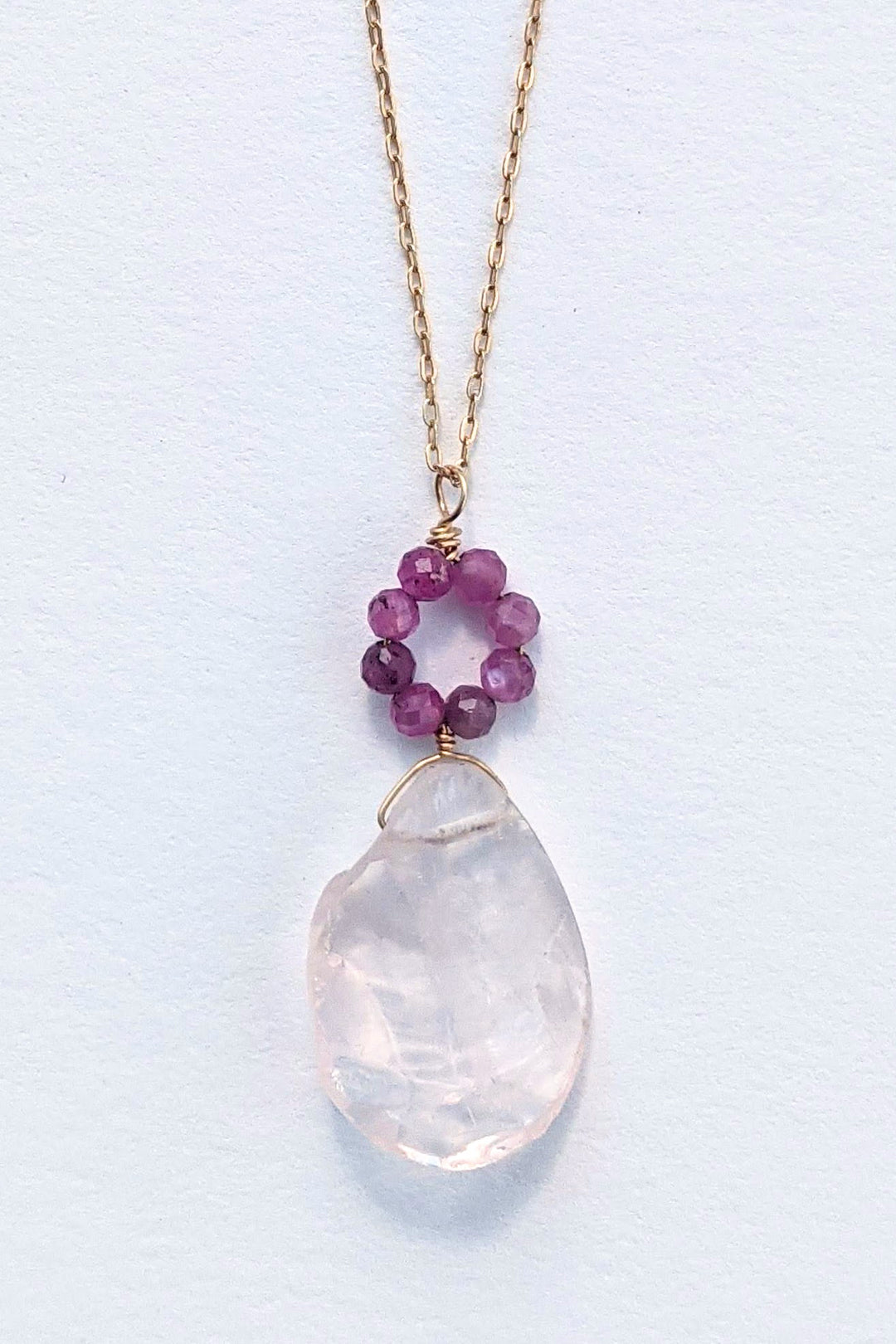 Daisy Drop necklace, delicate gold chain with ruby and rose quartz flower charm. By jewelry artisan Alison Jefferies of J'Adorn Designs.