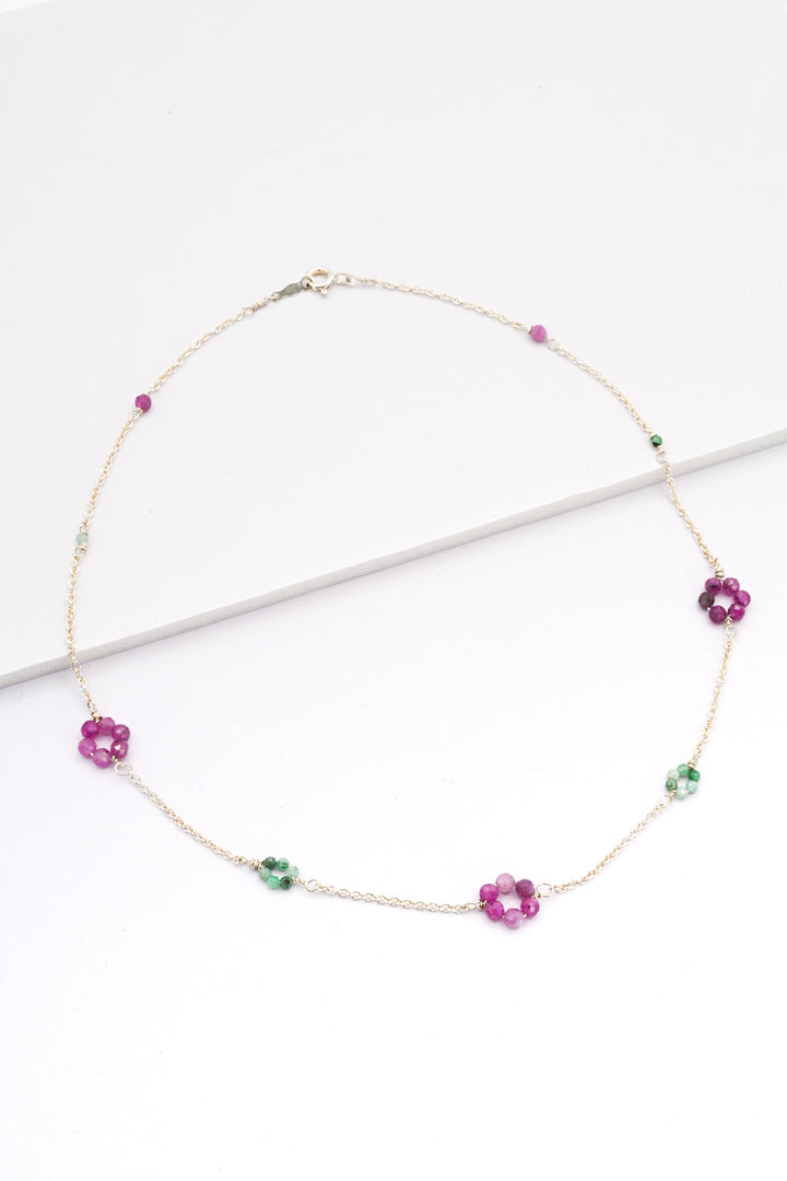 Silver daisy chain necklace with emerald and ruby flowers, and delicate sterling silver chain. 