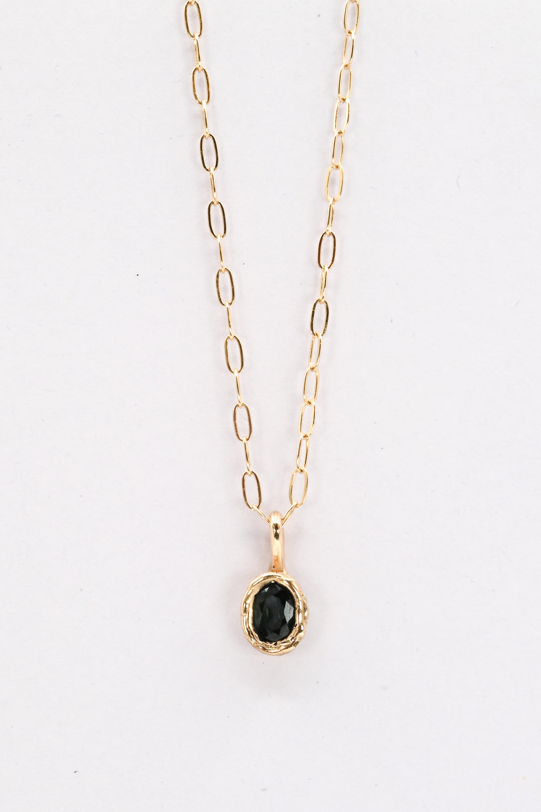 Dark green oval sapphire in a 14k gold setting on a gold paperclip chain, by J'Adorn Designs