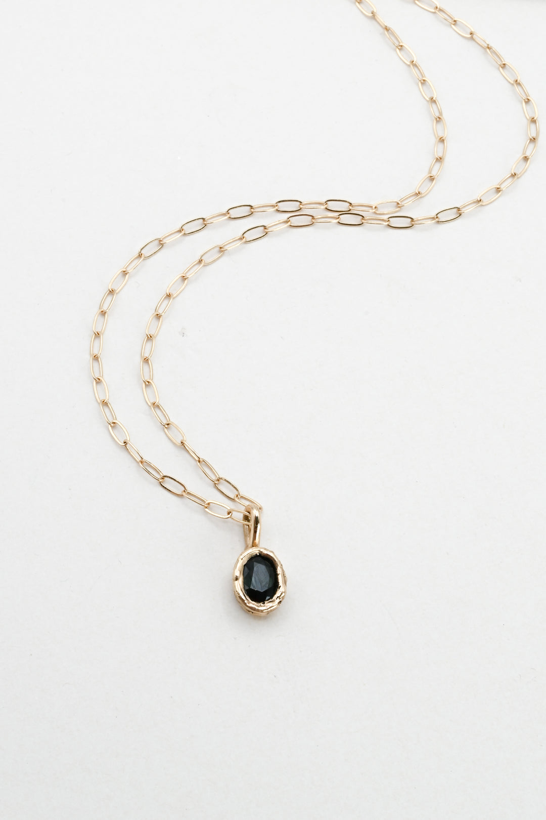 Dark green oval sapphire in a 14k gold setting on a gold paperclip chain, by J'Adorn Designs