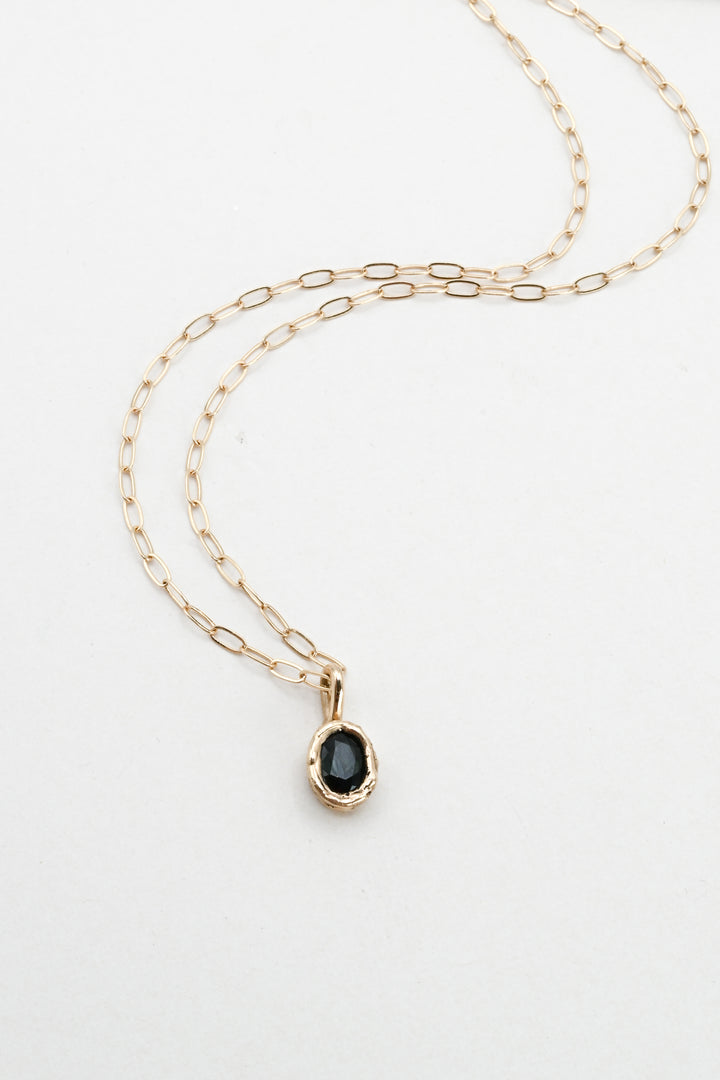 Dark green oval sapphire in a 14k gold setting on a gold paperclip chain, by J'Adorn Designs