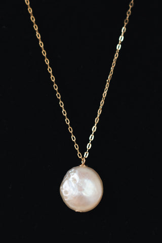 Delicate freshwater pearl pendant necklace in gold. One white freshwater coin pearl on a fine golden chain by J'Adorn Designs jewelry designer Alison Jefferies