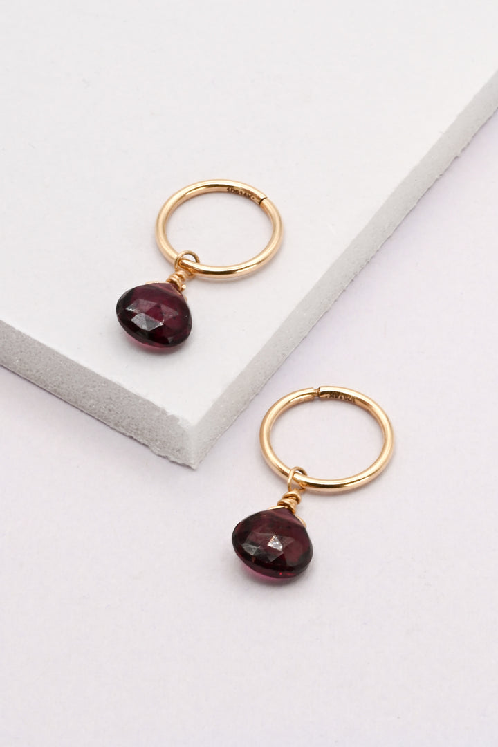 Gold Seamless Huggie Hoops with Garnet Drops