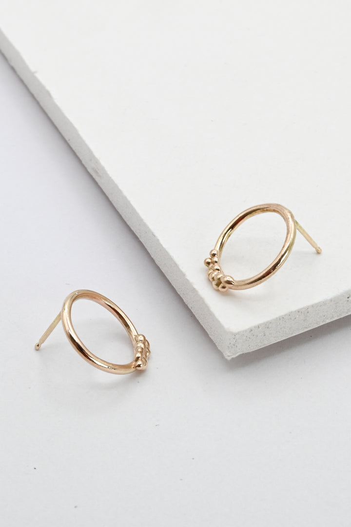 Side view of Gold Bubble Hoop Stud Earrings by J'Adorn Designs