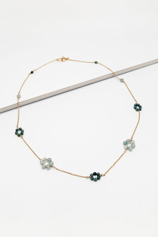 Dainty gold daisy choker necklace with aquamarine and paraiba tourmaline gemstone flowers by Alison Jefferies of J'Adorn Designs