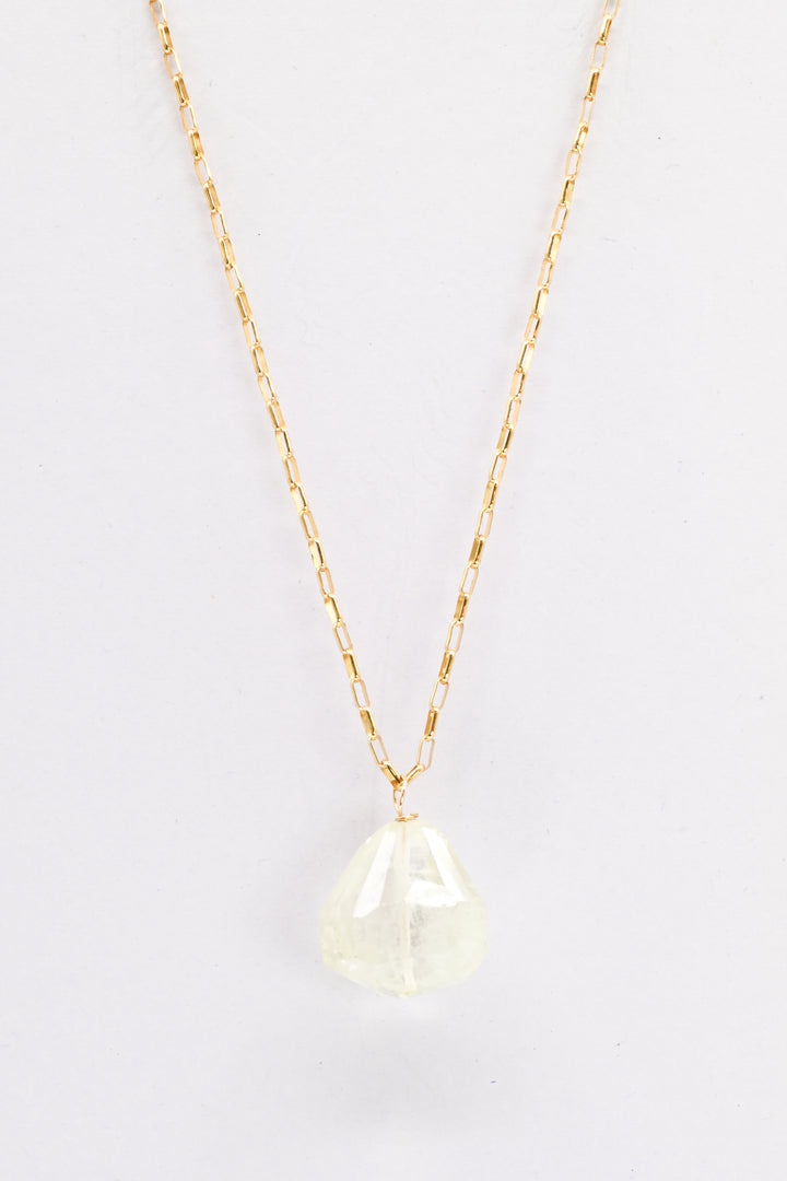 Gold necklace with a light green aquamarine teardrop pendant