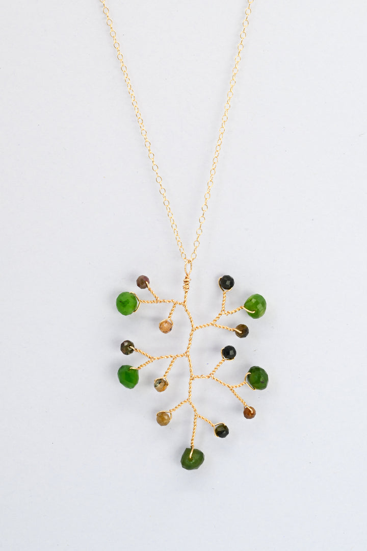 Delicate gold wire wrapped branch necklace with green jade teardrops and earthy brown and green tourmaline accent beads on a delicate gold chain