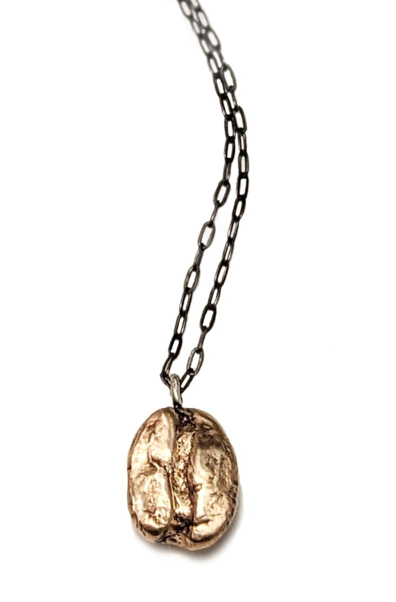 Artisan handcrafted short necklace by J'Adorn Designs artist Alison Jefferies. One bronze cast coffee bean pendant necklace with a black sterling silver chain. Perfect gift for a coffee lover!