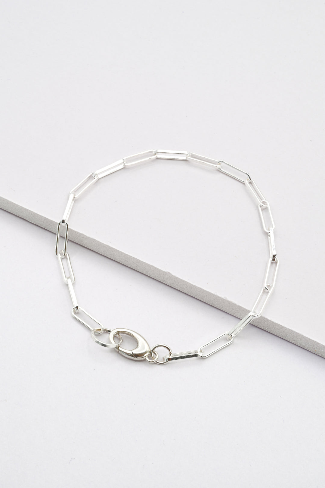 Silver paperclip chain bracelet with charm holder clasp by J'Adorn Designs