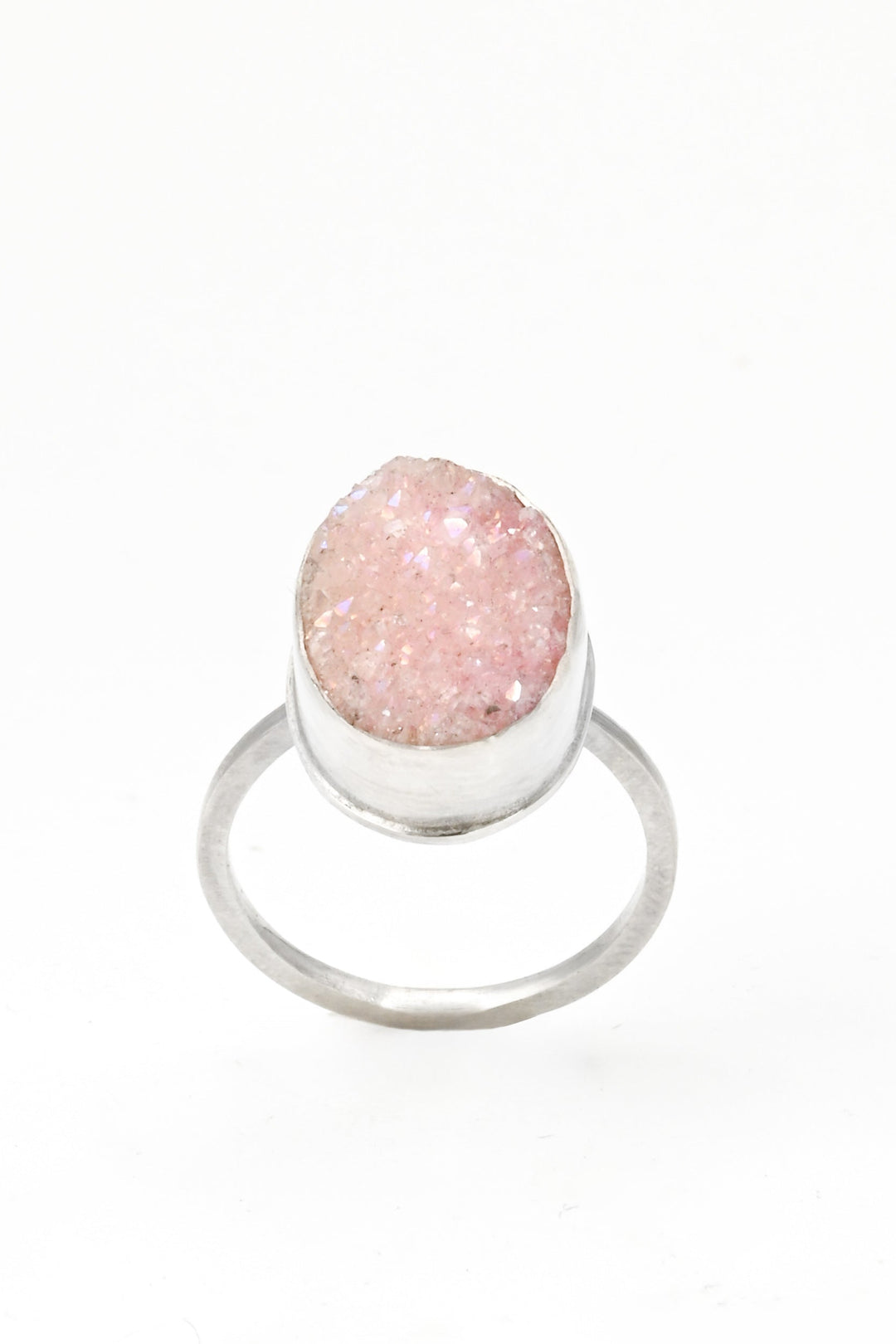 Top view of a pink bezel-set oval druzy on a square sterling silver band by J'Adorn Designs