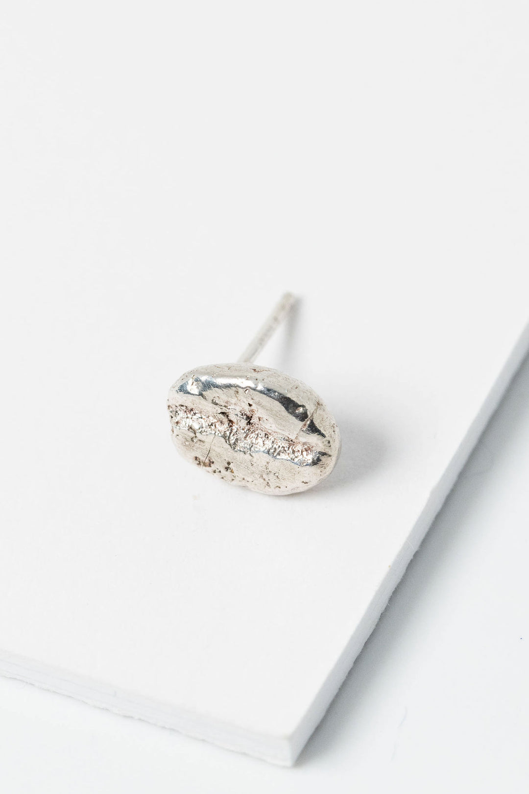 Sterling silver coffee bean stud earring; single post earring for mix and match style and gender inclusive fashion.