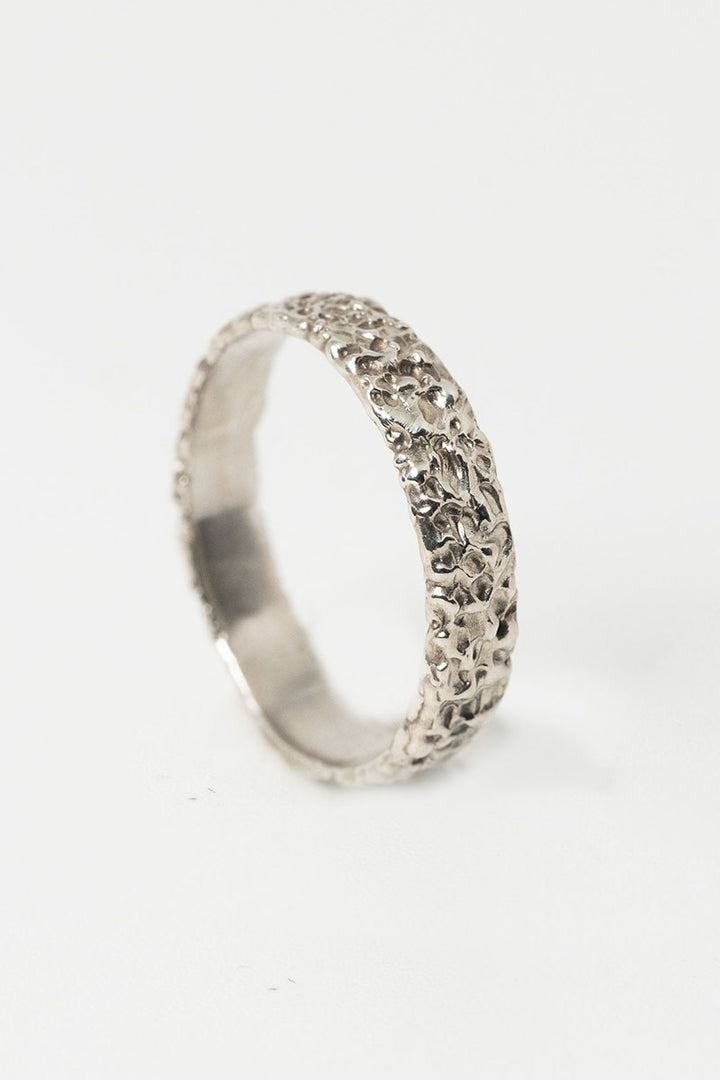 Sterling silver textured crater band stacking ring by J'Adorn Designs