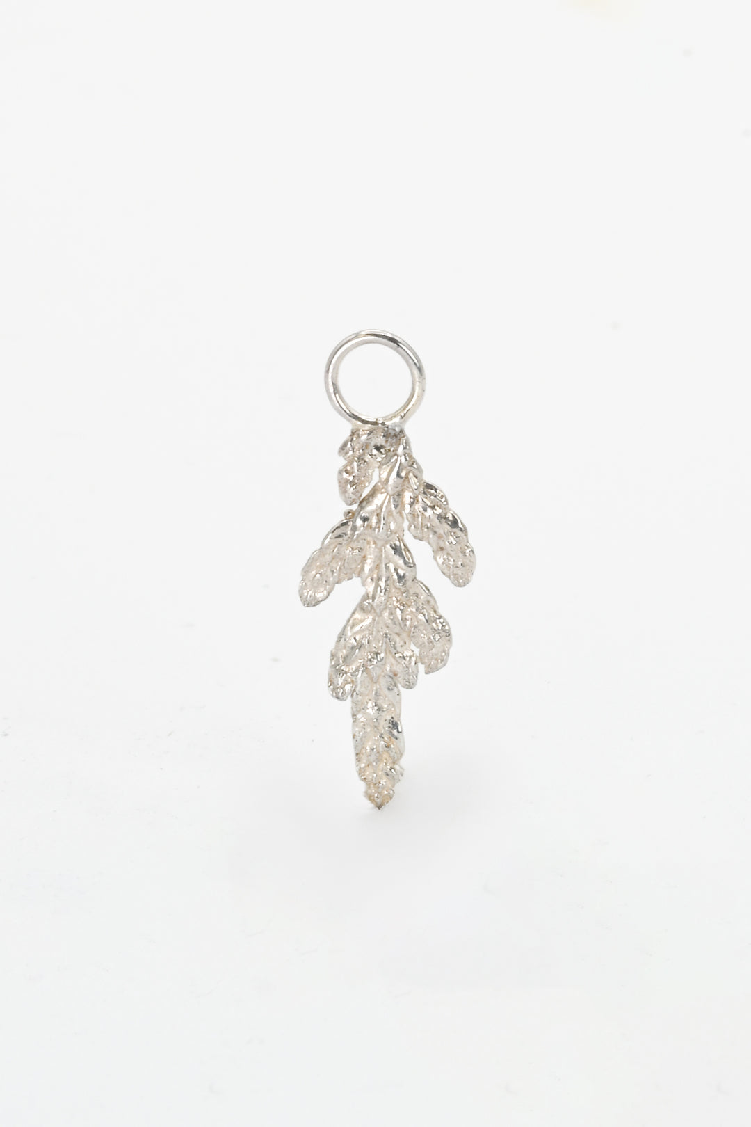Small cast silver evergreen leaf charm by J'Adorn Designs