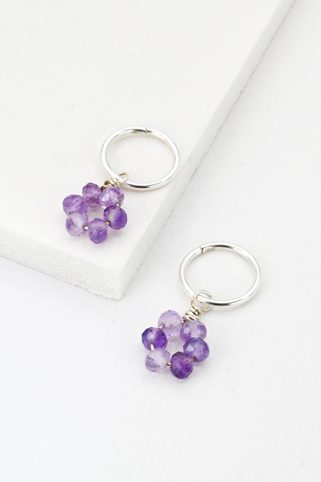 Tiny silver hoop earrings with purple amethyst flower dangle charms by J'Adorn Designs
