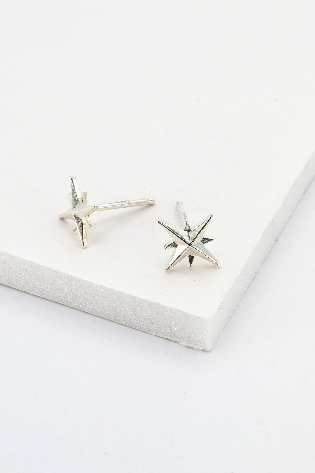 Sterling silver star post earrings against a white background by J'Adorn Designs