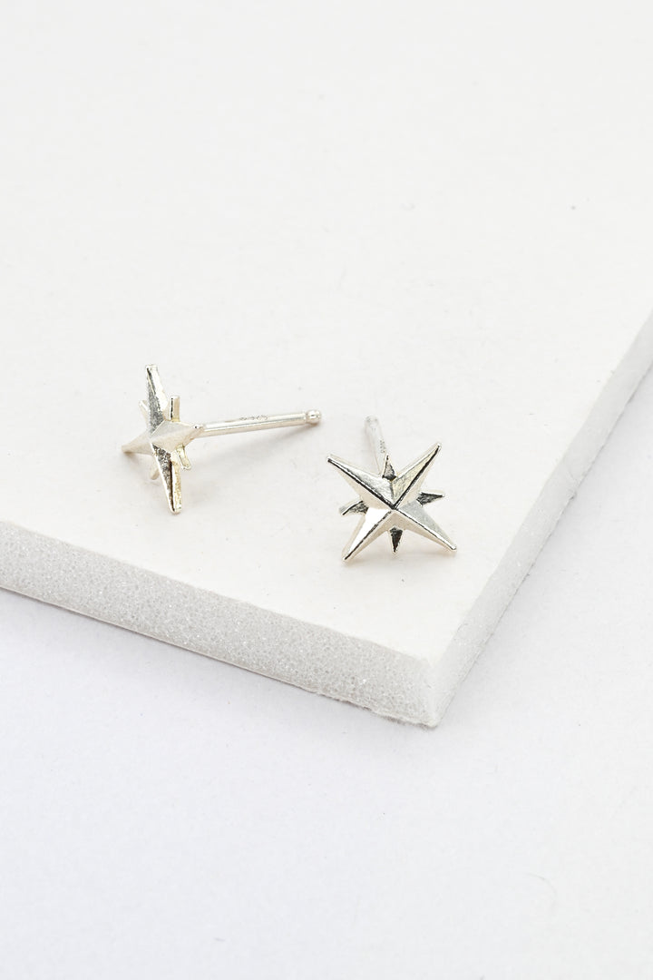 Sterling silver star post earrings against a white background by J'Adorn Designs