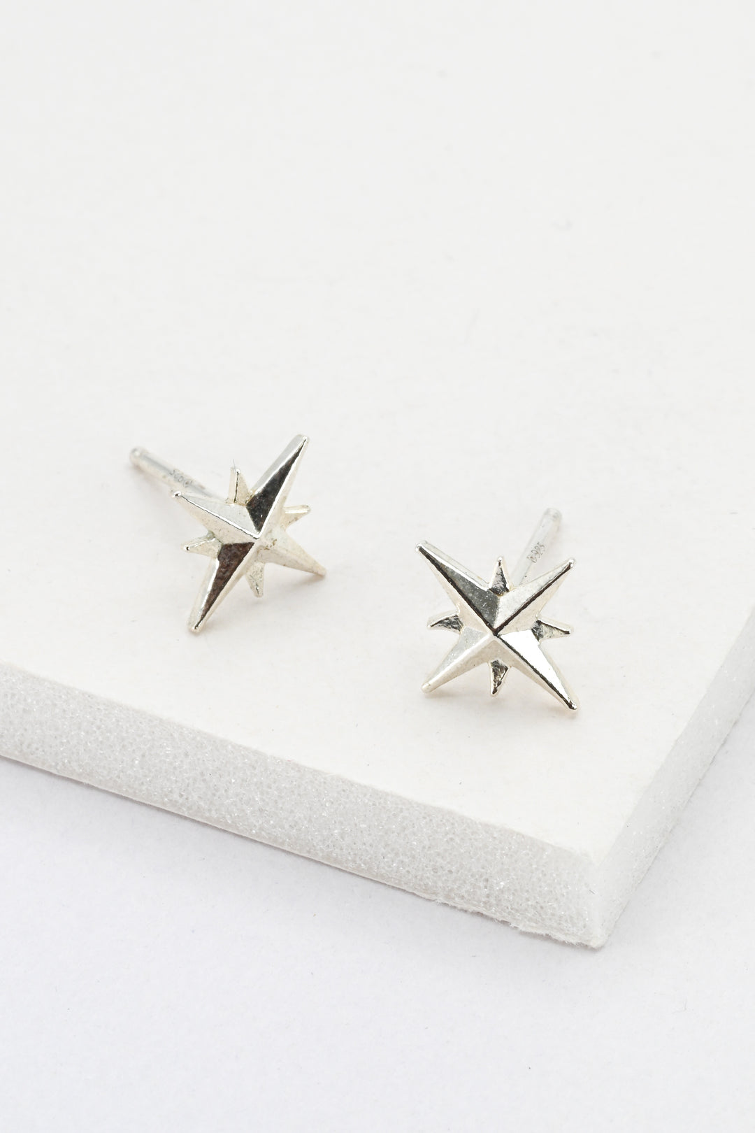 Sterling silver star post earrings against a white background by J'Adorn Designs