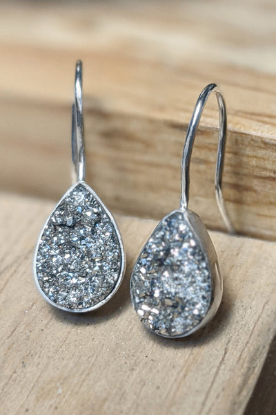 Small silver druzy teardrop earrings in sterling silver bezel setting. Handcrafted druzy gemstone earrings by Alison Jefferies, jewelry designer at J'Adorn Designs