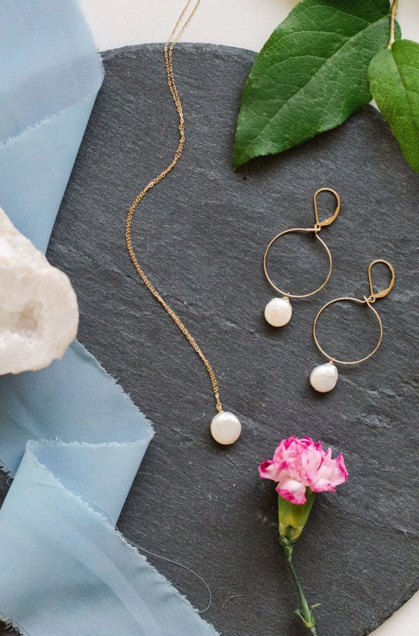 Delicate gold hoop earrings with white freshwater coin pearl drops, hand crafted jewelry by Alison Jefferies of J'Adorn Designs