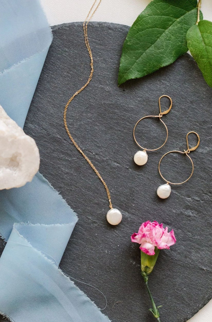 Delicate gold hoop earrings with white freshwater coin pearl drops, hand crafted jewelry by Alison Jefferies of J'Adorn Designs